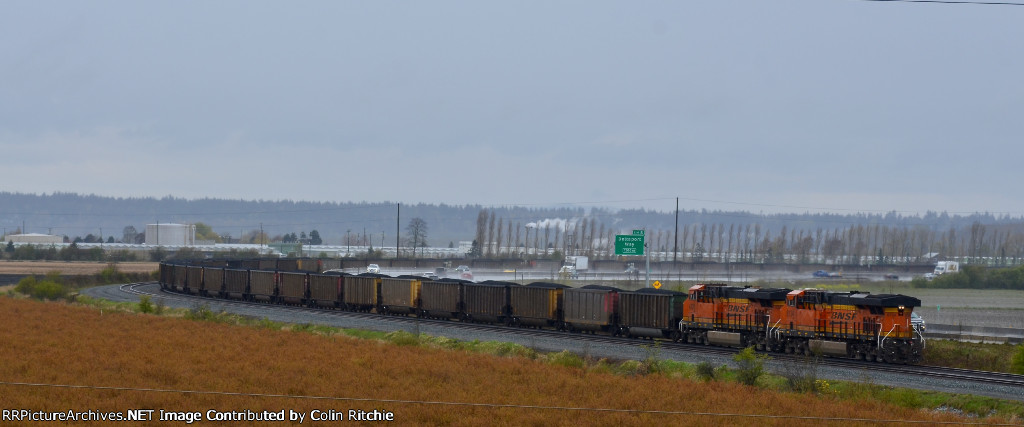 BNSF 4203/8134 trailing DPUs on a W/B loaded unit coal train rounding the curve through Fisher Siding and into Robert's Bank.